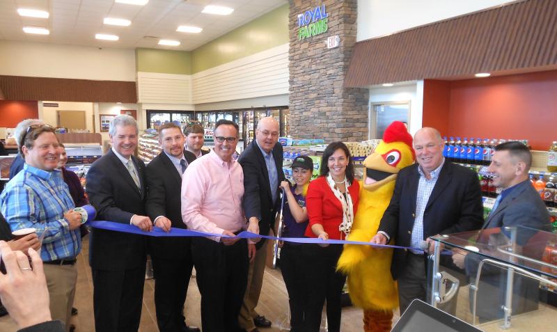Free fried chicken brings a crowd. On hand for the ribbon cutting of the new Royal Farms in Rehoboth are (l-r) Royal Farms President John Kemp, DNREC Secretary Shawn Garvin, Royal Farms District Leader Sam Caudill, Sen. Ernie Lopez, R-Lewes, Sussex County Council President Michael Vincent, Store Manager Bionca Wood, Rehoboth Councilwoman Kathy McGuiness, the Royal Farms chicken, Speaker of the House Rep. Pete Schwartzkopf, D-Rehoboth and Royal Farms Operation Leader Ralph Desantis. CHRIS FLOOD PHOTO